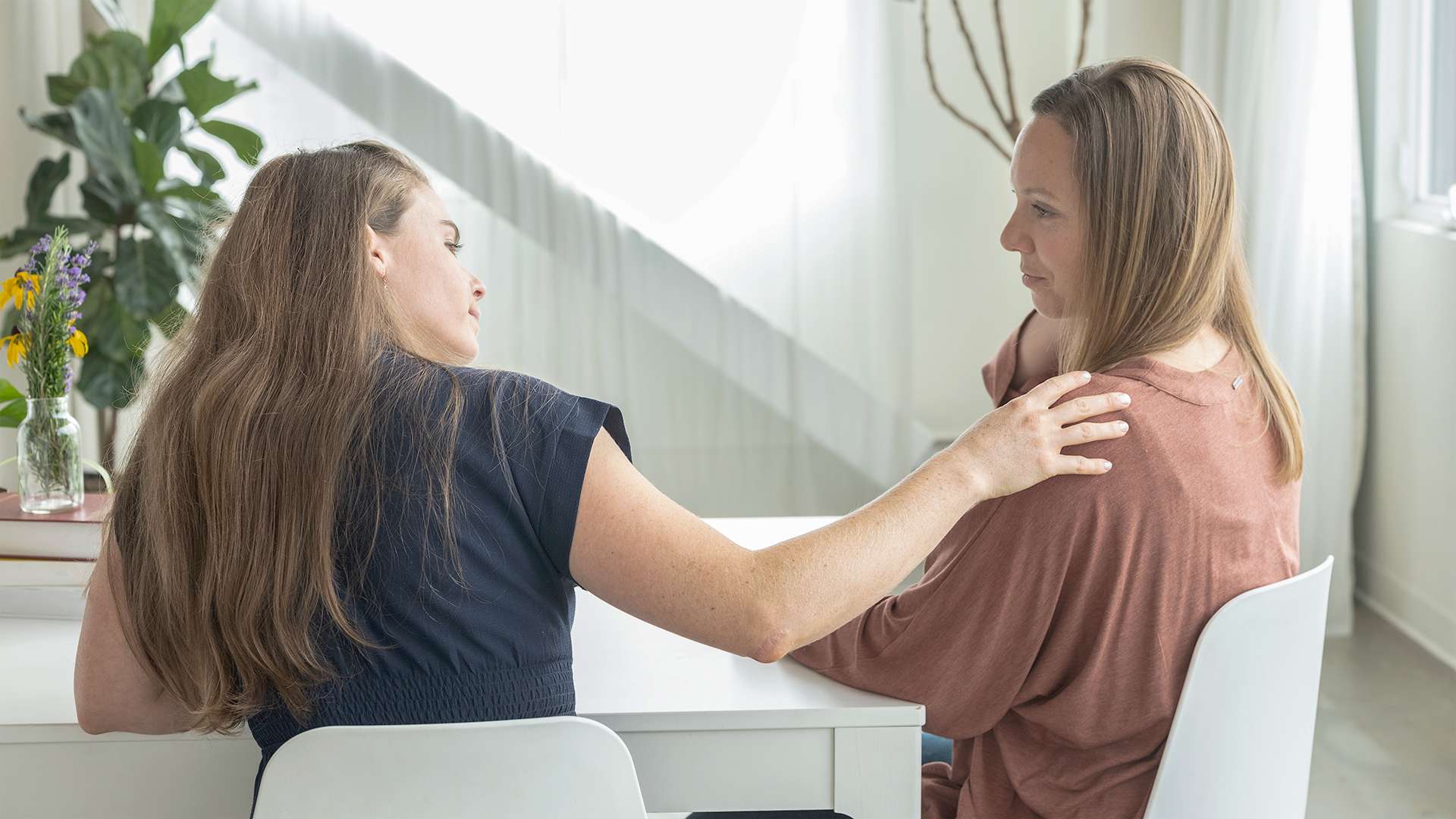 Holistic Medical Doctor Listening and Comforting her Patient-8346